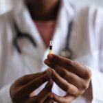 doctor holding an injection needle