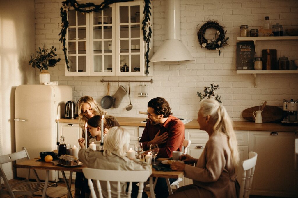 family sitting around the dinner table holidays