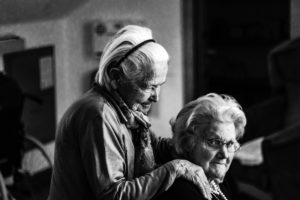 two elderly women sitting together