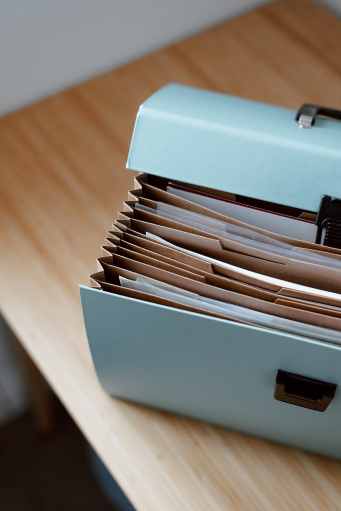 briefcase with documents placed on table