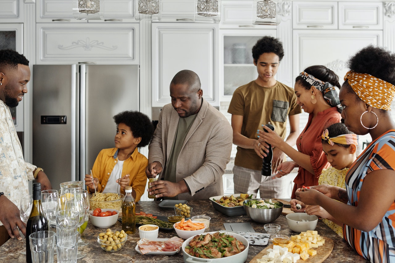 family preparing food in the kitchen