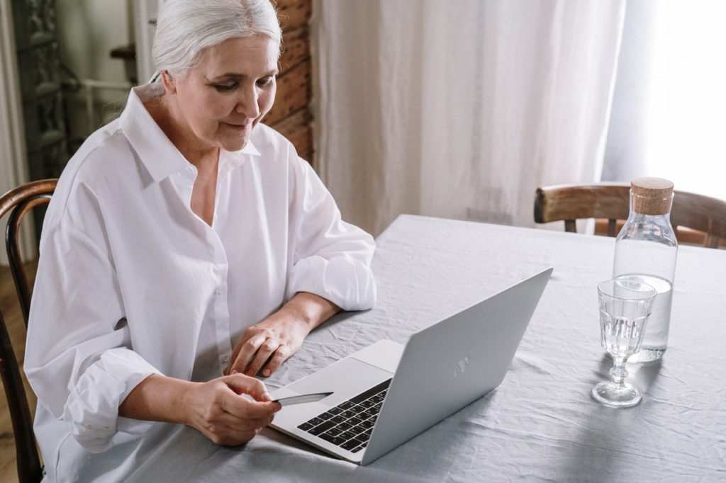 old woman using a laptop