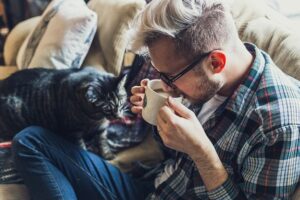 Guy with dog on couch